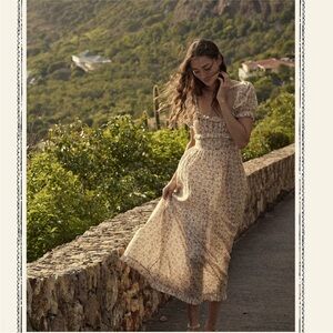 DÔEN Gia ruffled floral-print organic cotton-blend voile midi dress